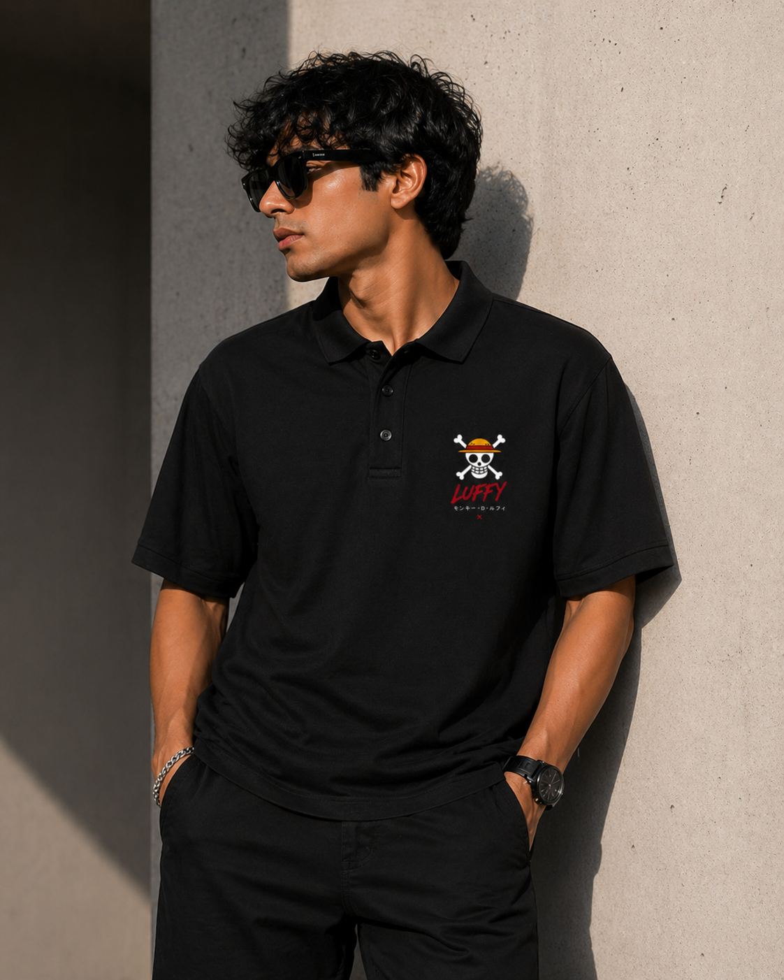Front view of a black structured pique polo t-shirt with a small iconic chest graphic for a sharp urban look.
