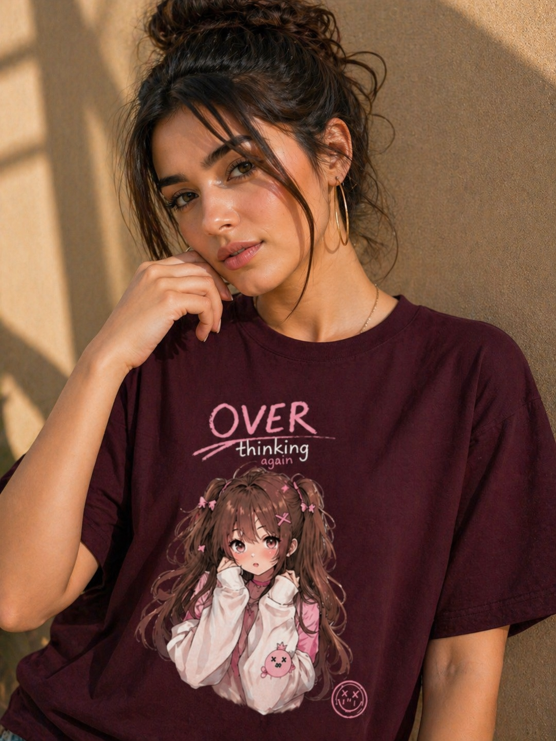 Close-up view of the maroon heavyweight t-shirt featuring the artistic overthinking girl graphic print.