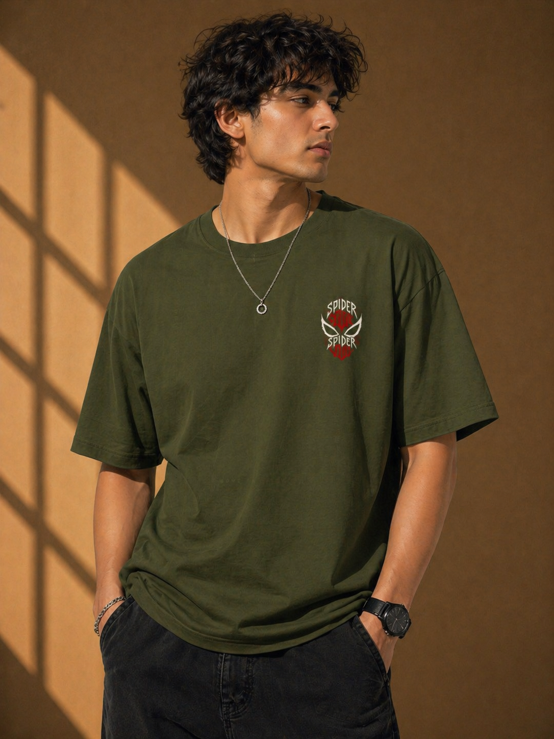 Front view of the Olive Green heavyweight oversized t-shirt with a sharp spider graphic print and boxy fit.